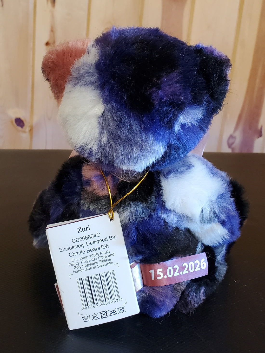 Zuri - 11" Bear w/ blue, black, cream, and pink - by Charlie Bears